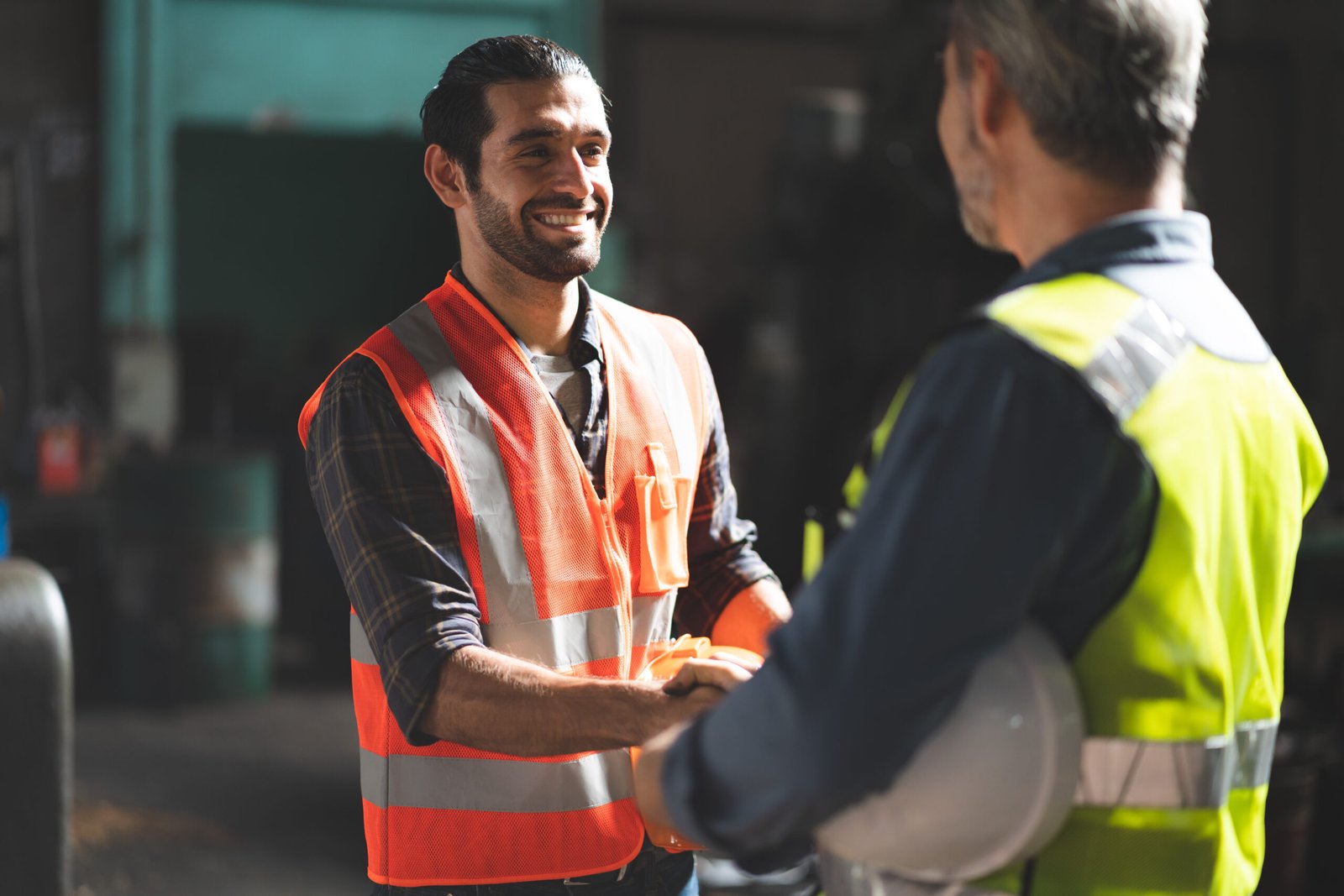 factory engineer talking and shaking hands on business cooperation agreement. Successful deal